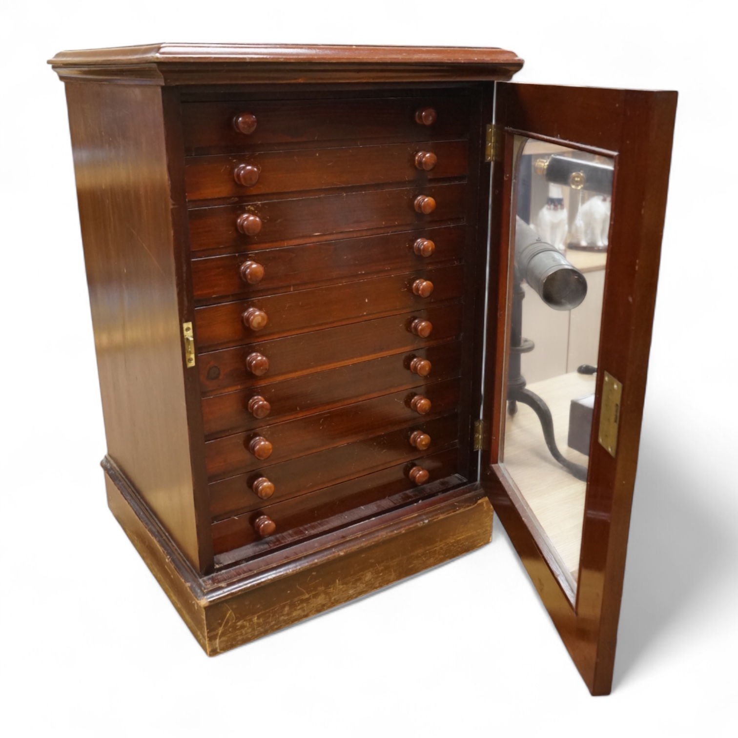 A Victorian ten drawer mahogany collector’s cabinet, containing a large selection of taxidermy moths, the contents checked against the UK register, each drawer with glazed cover, with a lockable glazed main door and orig